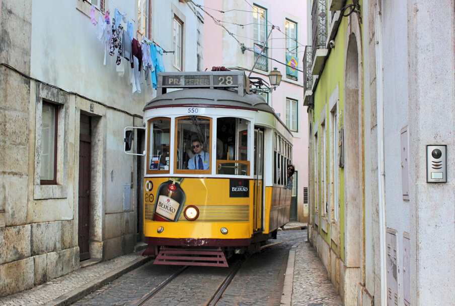 Yellow tram in city street